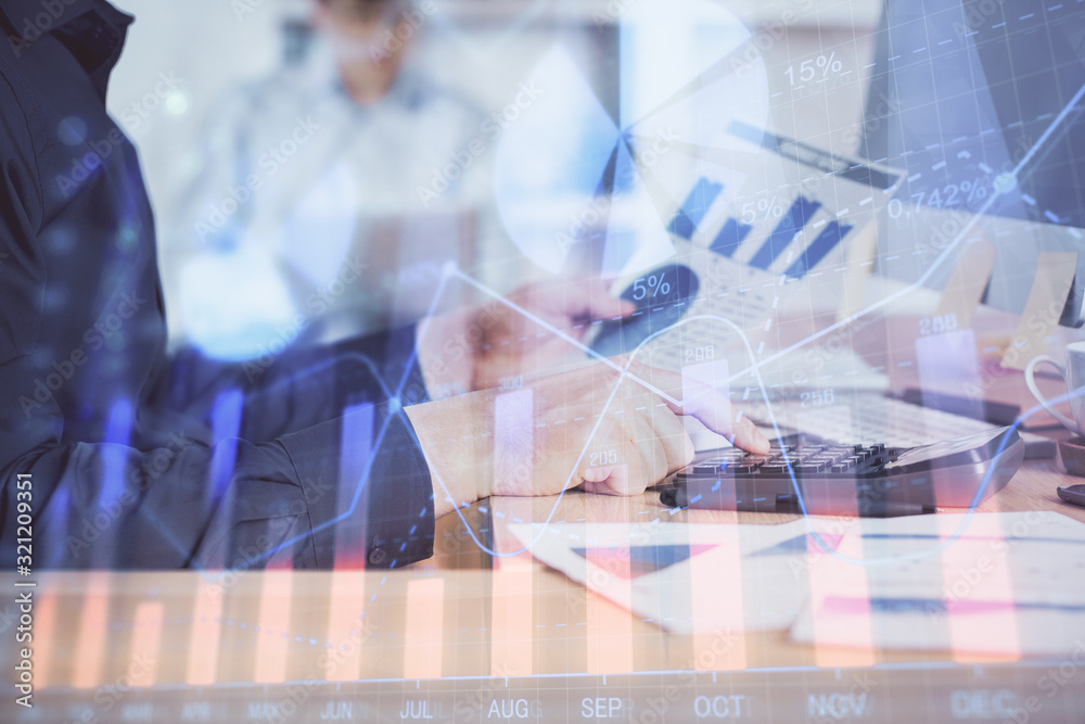 Double exposure of graph with man typing on computer in office on background. Concept of hard work. Closeup. Double exposure of graph with man typing on computer in office on background. Concept of hard work. Closeup.