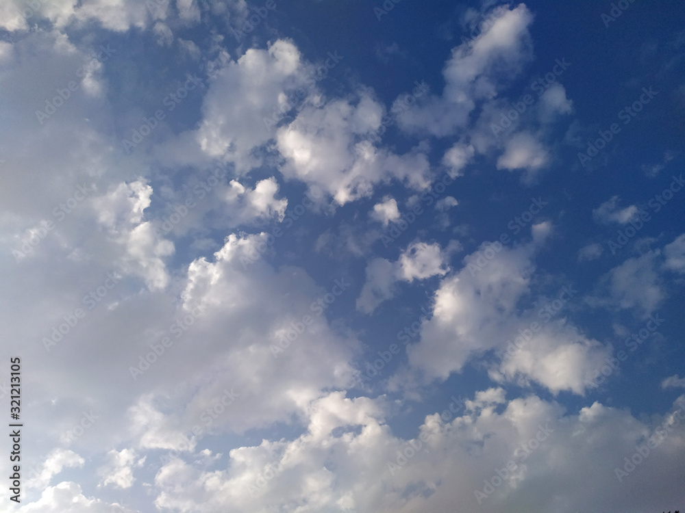 Fototapeta premium Fantastic soft white clouds against blue sky