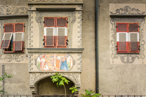Historic house in the historical city center of Brixen , Bressanone in South Tyrol, Trentino Alto Adige, northern Italy. Detail of the windows and the external fresco