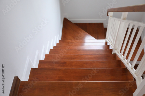 brown wooden stair interior decorated modern style of residential house