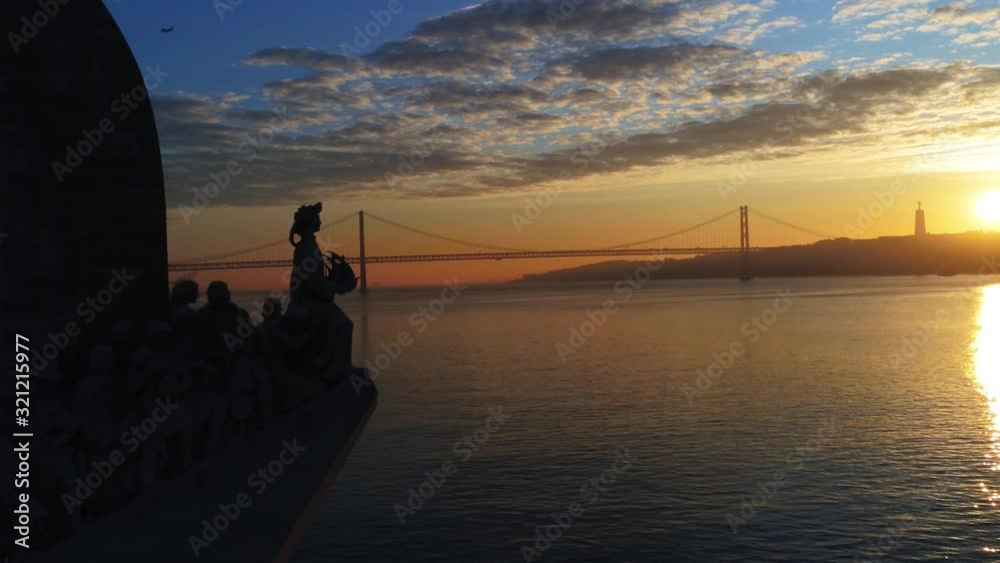 Aerial shot of the monument to the discoveries at sunset. Belem District. Lisbon, Portugal.