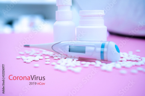 Concept novel coronavirus 2019-nCoV. Chinese coronavirus outbreak. MERS-Cov middle East respiratory syndrome coronavirus.Pills and thermometer with CORONAVIRUS text. Virus Pandemic Protection Concept