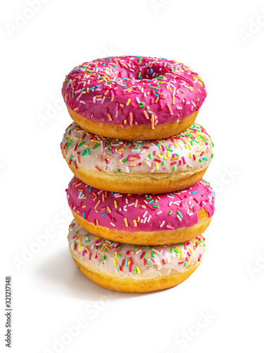 Four doughnuts lie on top of each other on a white background