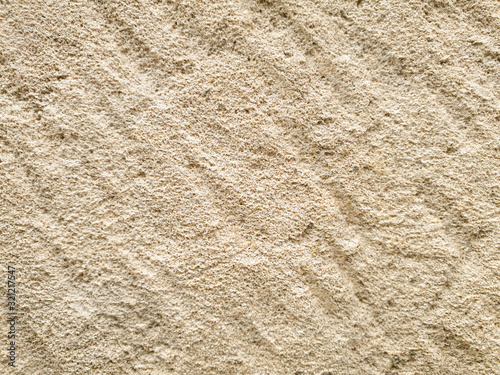 Tableau sur toile Beige chipped stone or cut stone texture background