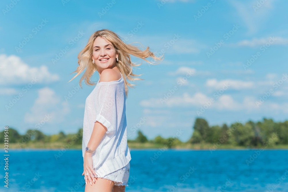 Spring - Summer season. Vacation and travelling time. Woman at sea, pretty nice view  