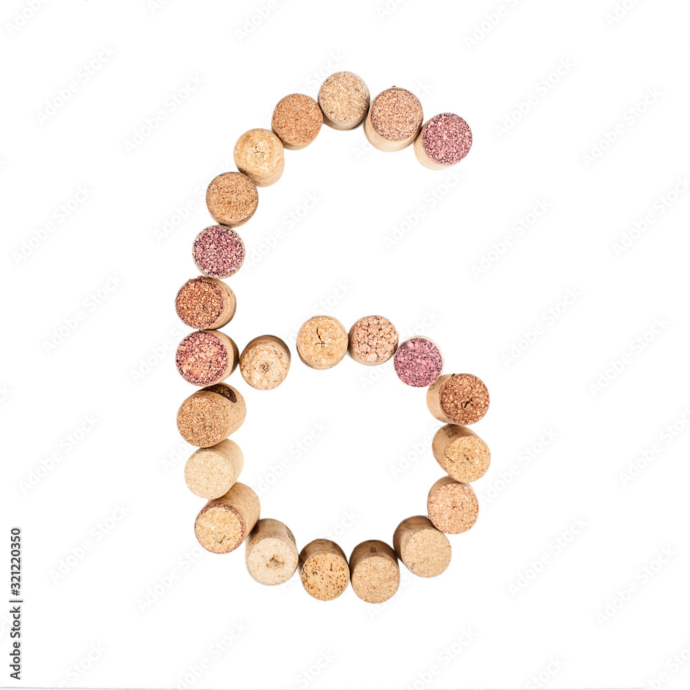 The number 6 is made from wine corks, close-up. Isolated on white background The number 6 is made from wine corks, close-up. Isolated on white background