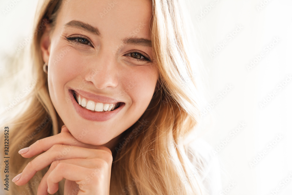 Beautiful woman indoors at home looking camera. Beautiful woman indoors at home looking camera.