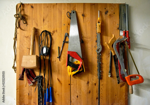Carpenter's tools on the wall. Joinery. Manufacture of wood products. Carving. Woodworking.