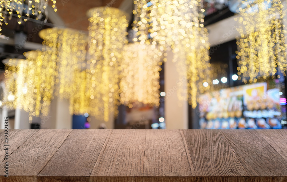 Empty dark wooden table in front of abstract blurred bokeh background of restaurant . can be used for display or montage your products.Mock up for space. Empty dark wooden table in front of abstract blurred bokeh background of restaurant . can be used for display or montage your products.Mock up for space.