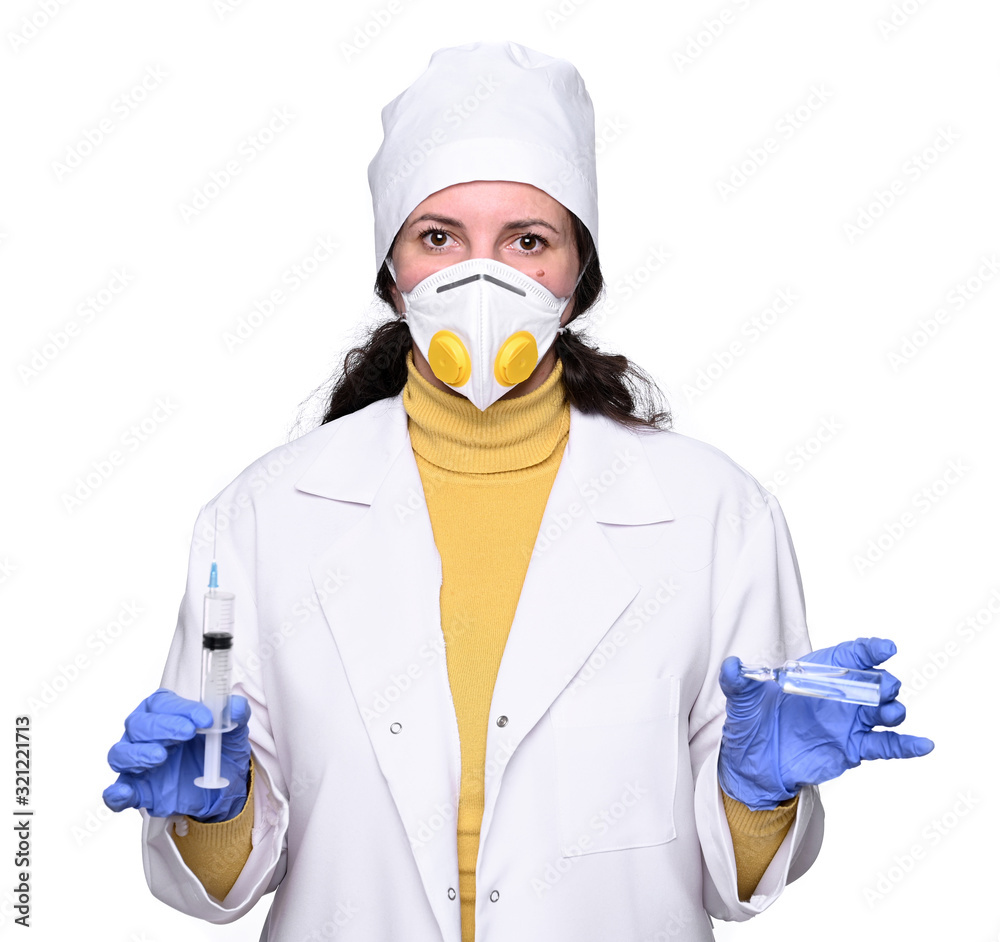 Healthcare and medicine concept. Female doctor in mask holding syringe and ampoule Healthcare and medicine concept. Female doctor in mask holding syringe and ampoule