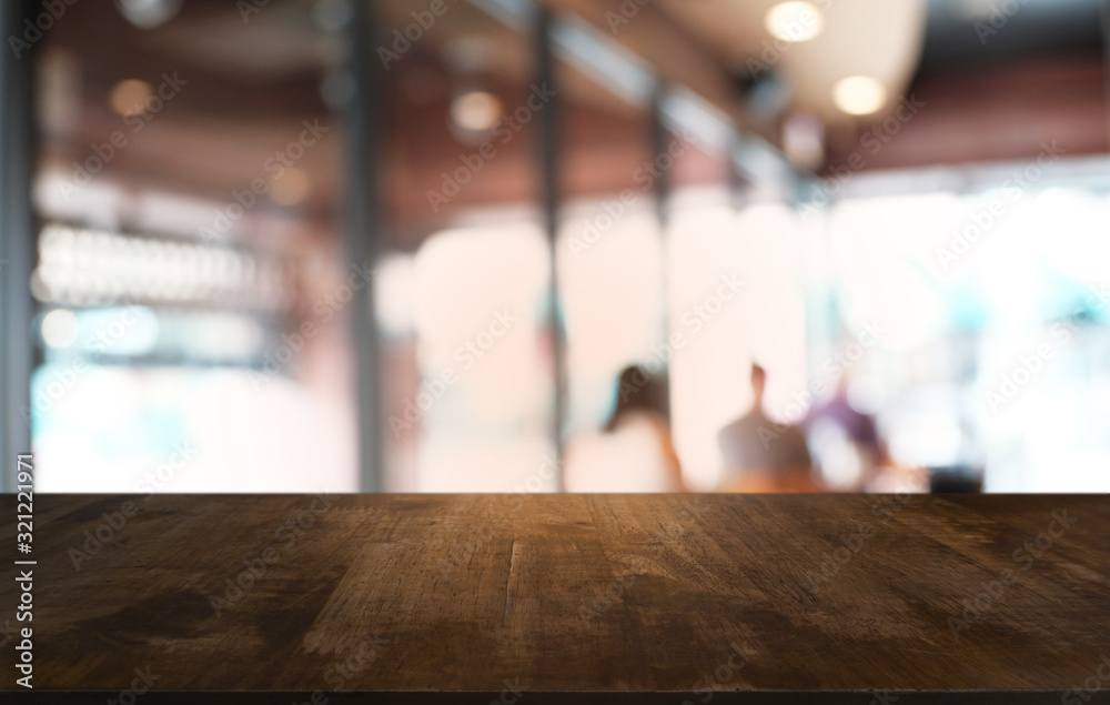 Empty dark wooden table in front of abstract blurred bokeh background of restaurant . can be used for display or montage your products.Mock up for space. Empty dark wooden table in front of abstract blurred bokeh background of restaurant . can be used for display or montage your products.Mock up for space.