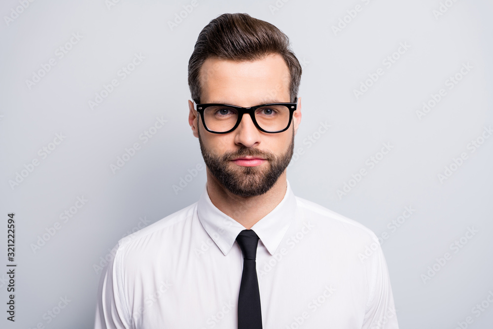 Closeup photo of young handsome serious business man bossy employer investor attentively look listen colleagues wear specs white office shirt tie isolated grey color background Closeup photo of young handsome serious business man bossy employer investor attentively look listen colleagues wear specs white office shirt tie isolated grey color background