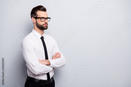 Profile photo of handsome young business man bossy crossed arms meet colleagues partners look empty space wear specs white office shirt black pants tie isolated grey color background photo