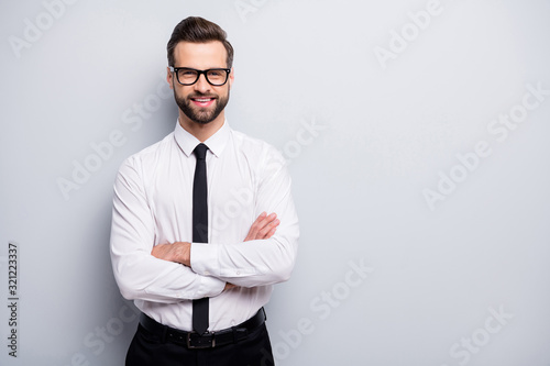Photo of handsome young business man bossy crossed arms friendly smiling meet colleagues partners wear specs white office shirt black trousers tie isolated grey color background