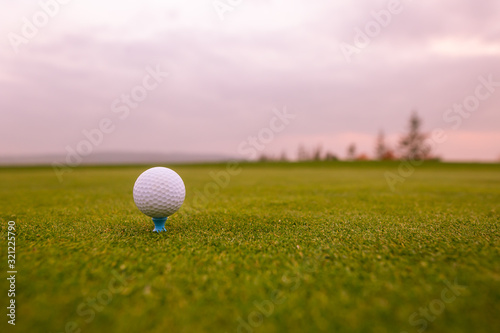 Close up of golf ball on the professional golf ground, ready for hit, sport concept