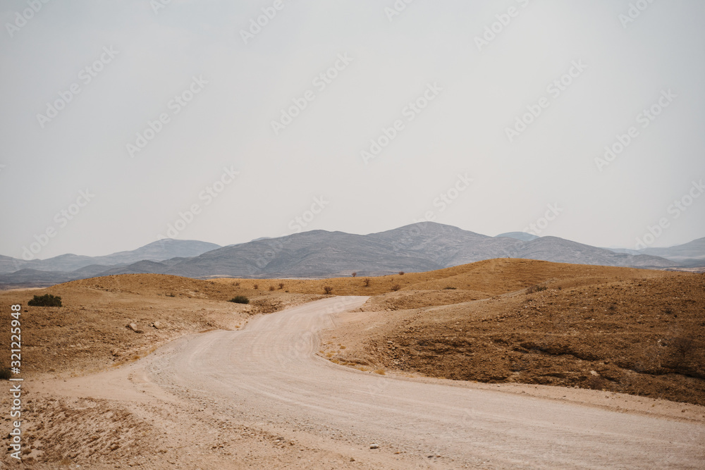 Desert gravel road through the surreal Moon Landscape