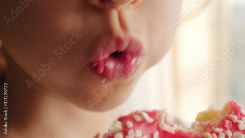 little girl eating red, pink donut, doughnut, macro, close