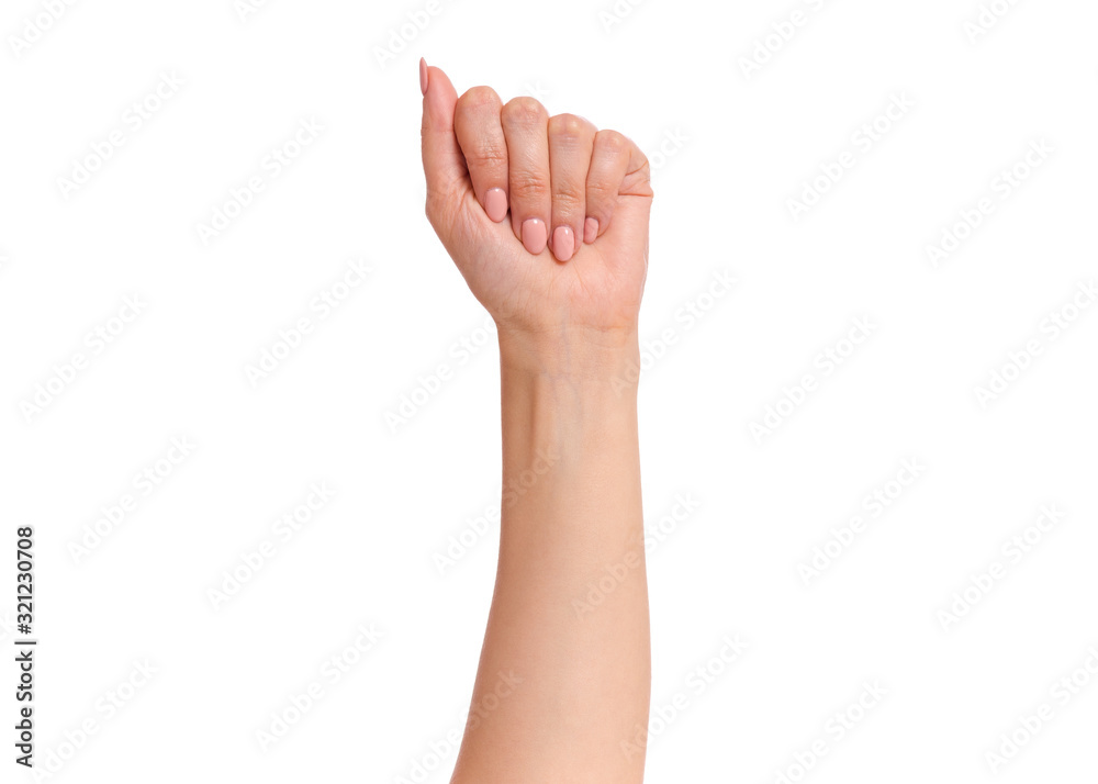 Female hand with fingers folded into fist, isolated on white background. Beautiful hand of woman with copy space. Female hand with fingers folded into fist, isolated on white background. Beautiful hand of woman with copy space.