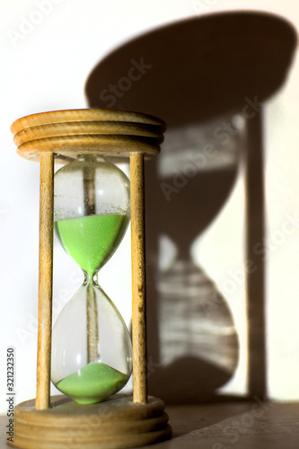 The hourglass from which the green sand flows. About the passage of time. The shadow of the time.