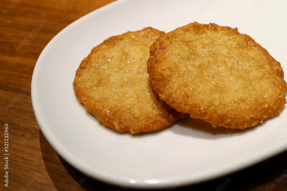 Pair of delectable butter cookies on a white plate Pair of delectable butter cookies on a white plate