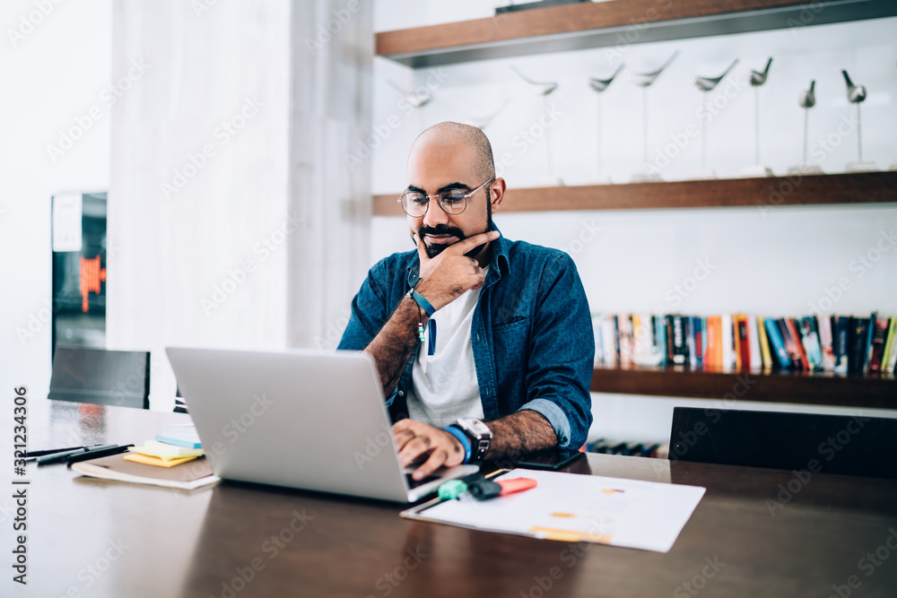 Busy employee watching computer at workplace Busy employee watching computer at workplace