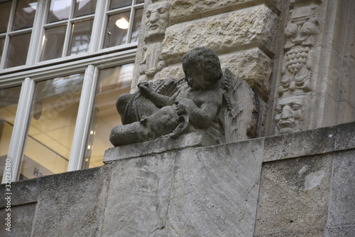 child sculpture made on a building wall