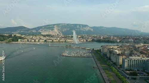 sunny evening geneva city famous lake fountain traffic bay aerial panorama 4k switzerland