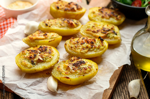 Stuffed potato halves with cheese and garlic