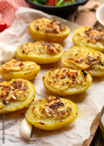 Stuffed potato halves with cheese and garlic