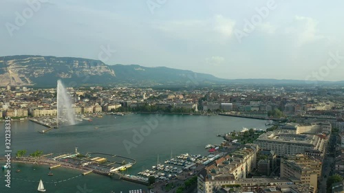 evening time geneva city lakeside fountain beach dock aerial panorama 4k switzerland