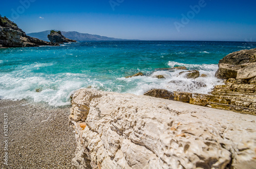 Turquoise blue and clear sea on the coast of Albania between Ksamil and Sarande photo