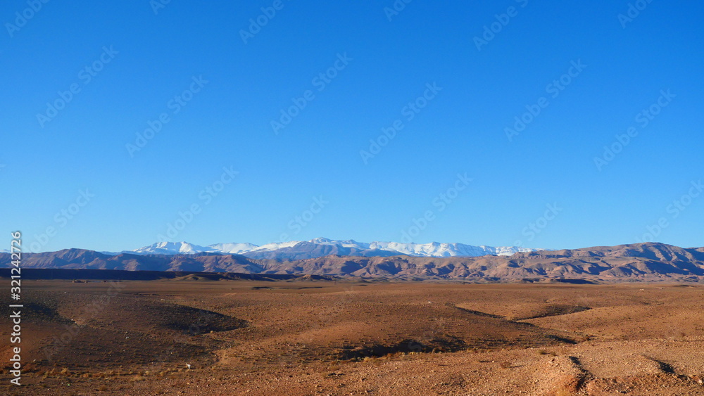 Bright landscape of Morocco, breathtaking curves of mountains, stunning combination of hills & farm land,inadvertent distribution of houses & huts, raw impression of pure nature.