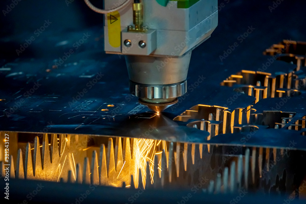 The close up scene of fiber laser cutting machine cutting the sheet
