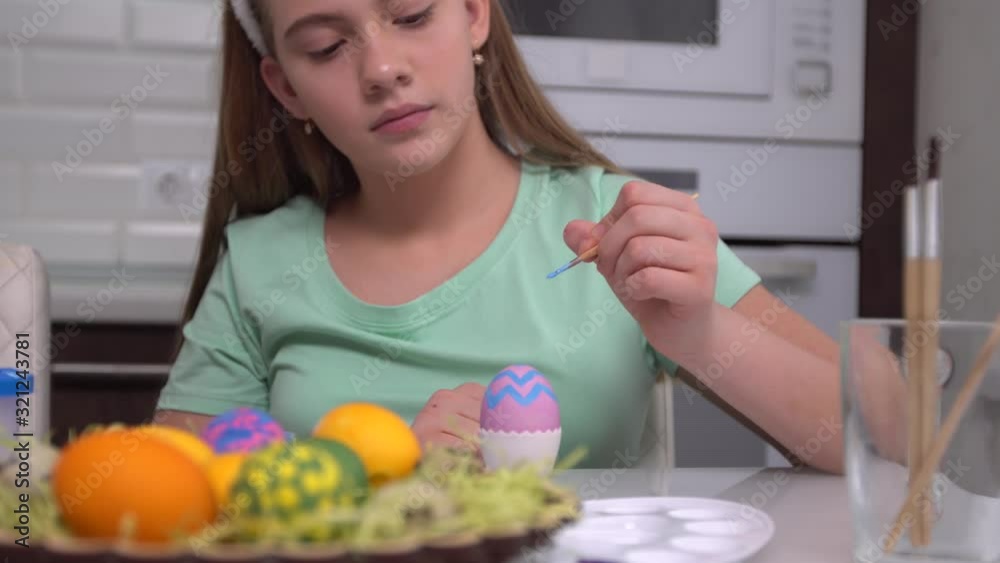 Happy easter. Girl painting Easter eggs. Happy family children preparing for Easter. Cute little child girl wearing bunny ears on Easter day. Happy easter. Girl painting Easter eggs. Happy family children preparing for Easter. Cute little child girl wearing bunny ears on Easter day.
