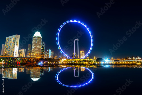 Beautiful Singapore cityscape at dusk. Landscape of Singapore business building around Marina bay. Modern high building in business district area at twilight and night.Effect Photo by long exposure.