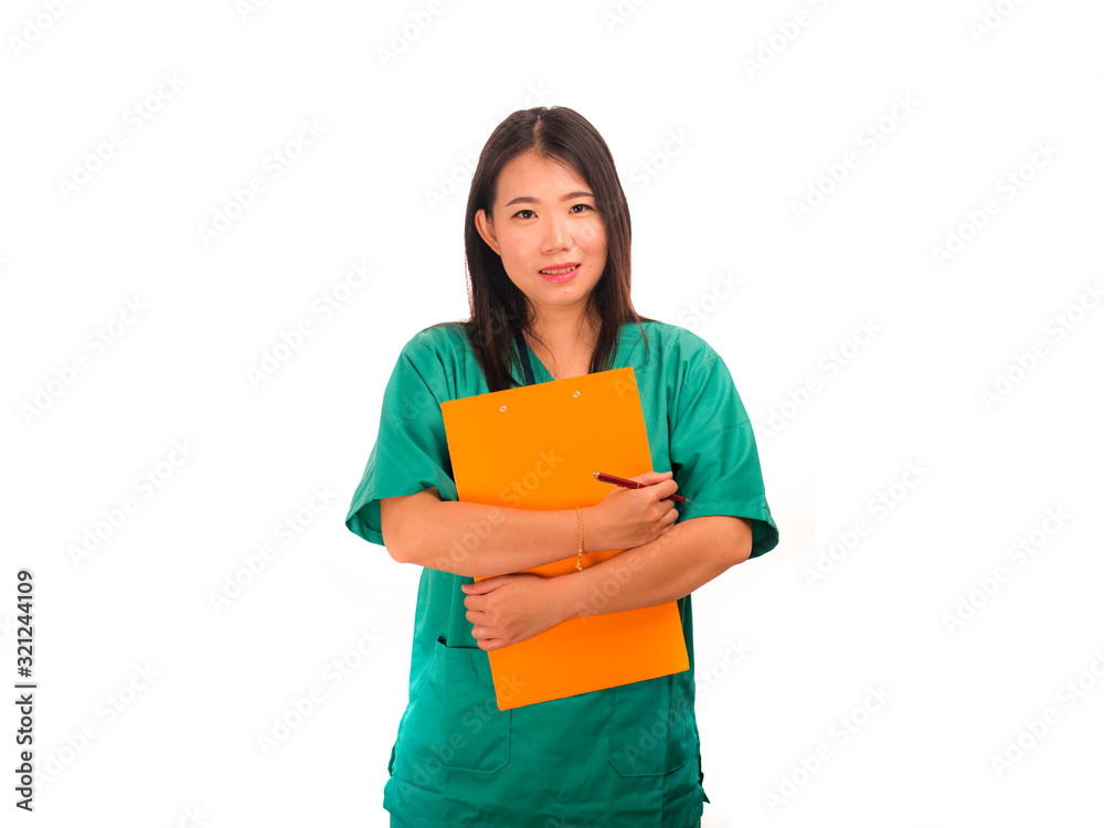 young beautiful and confident Asian Korean medicine doctor or hospital nurse woman smiling happy holding medical reports clipboard wearing scrubs in health care concept young beautiful and confident Asian Korean medicine doctor or hospital nurse woman smiling happy holding medical reports clipboard wearing scrubs in health care concept