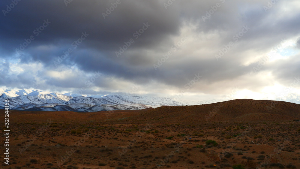 Bright landscape of Morocco, breathtaking curves of mountains, stunning combination of hills & farm land,inadvertent distribution of houses & huts, raw impression of pure nature.