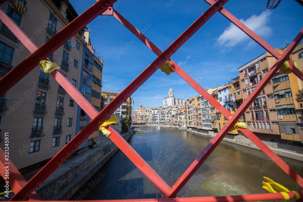 The Eiffel Bridge on the Onyar River at dusk in Girona, Catalonia (Spain)