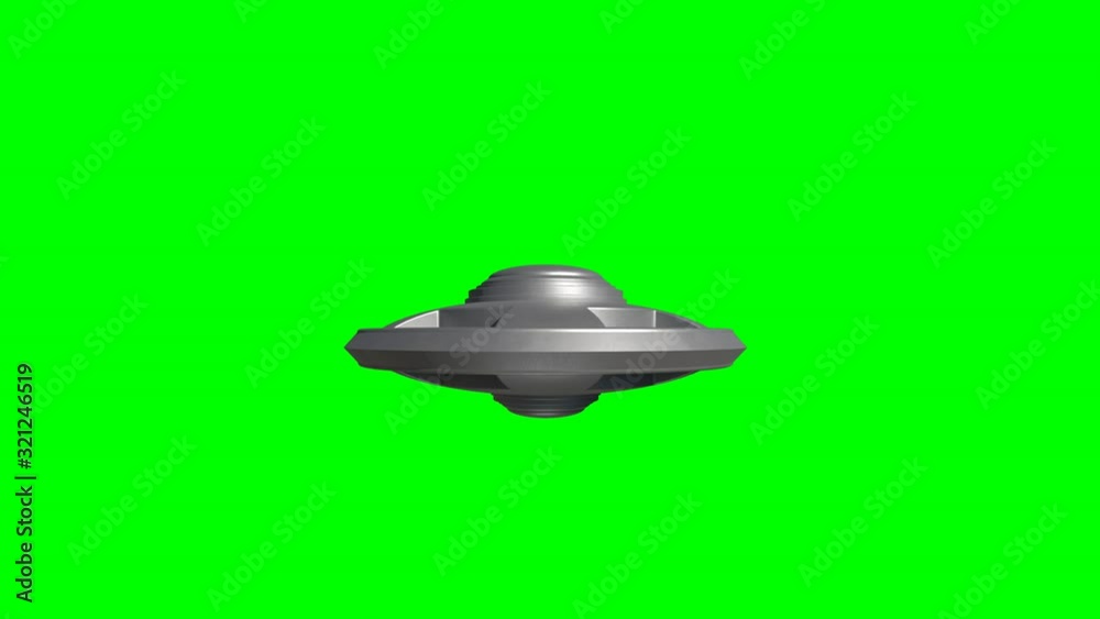 Metallic UFO alien spaceship flying isolated on green background Metallic UFO alien spaceship flying isolated on green background