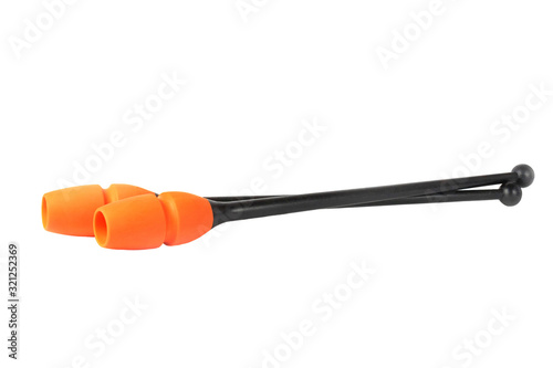 Orange clubs for rhythmic gymnastics isolated on white background, close up, high resolution