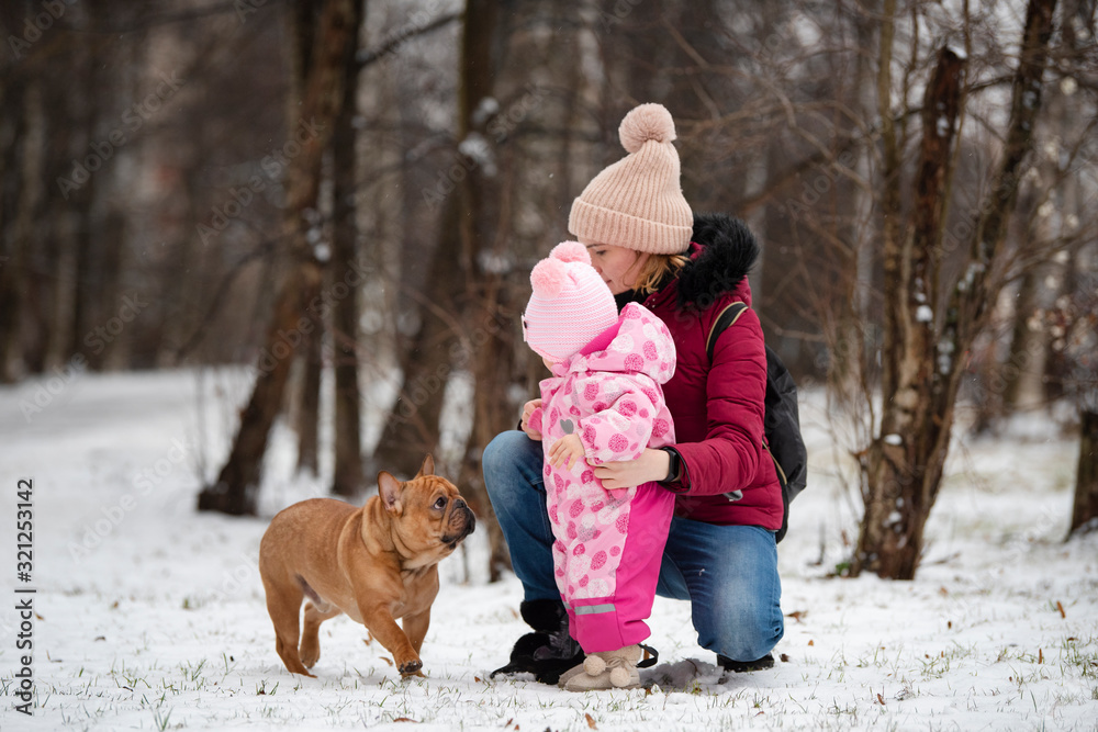 young mother introduces a child to a dog young mother introduces a child to a dog