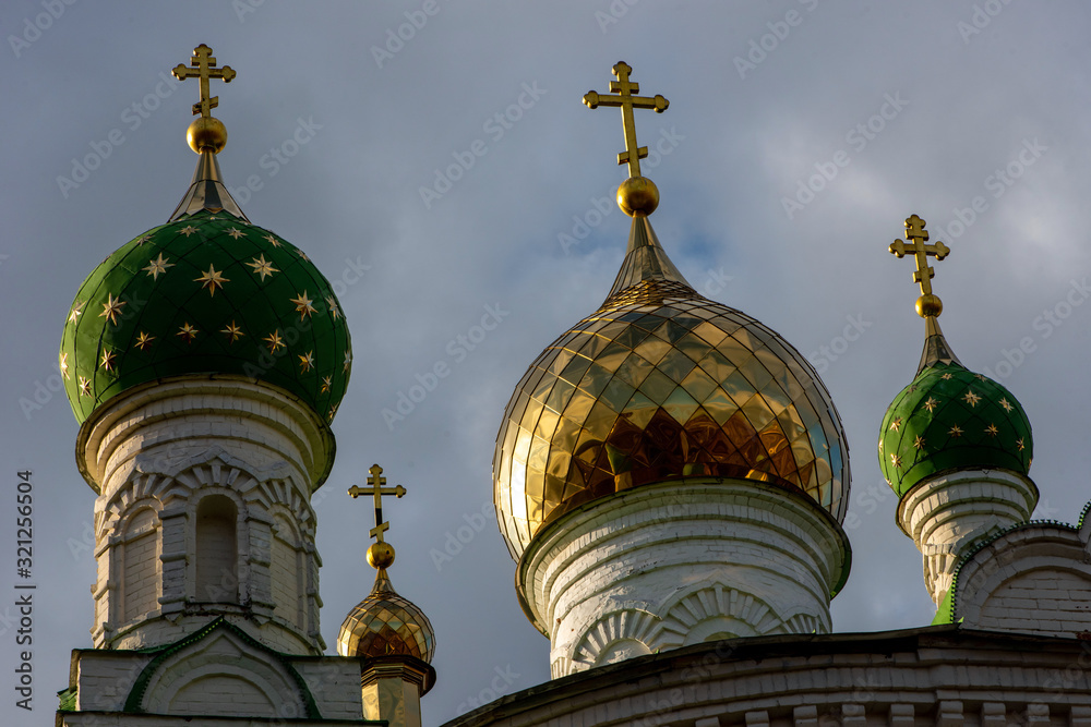 Domes of Orthodox churches against the sky and clouds.