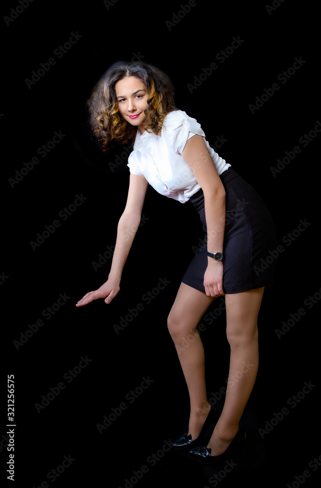 Vertical portrait photo of astonished business woman with dark hair impressed dipped arm shows decline in sales. Measurement unbelievable unexpected falls on black background. Copy space Vertical portrait photo of astonished business woman with dark hair impressed dipped arm shows decline in sales. Measurement unbelievable unexpected falls on black background. Copy space