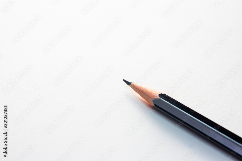Pencil isolated over white page in a notebook Pencil isolated over white page in a notebook