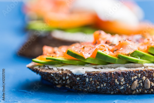Sandwich with smoked salmon and avocado. Concept for healthy nutrition.