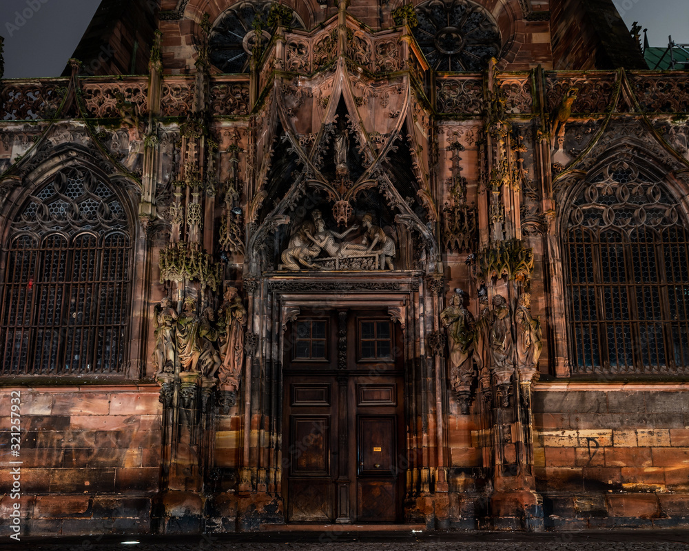 The side facade of the Cathedral in Strasbourg, richly decorated with sculptural compositions The side facade of the Cathedral in Strasbourg, richly decorated with sculptural compositions