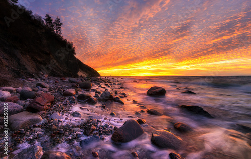 Magnificent, spectacular sunset over the sea. The Baltic Sea, Wolin National Park, Poland