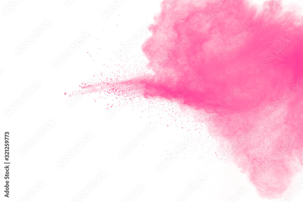 Abstract pink dust particles explosion on white background.Freeze motion of pink powder splash.
