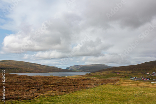 Beautiful meadows and lake in the mountains of the Faroe Islands
