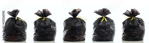 Trash, black garbage bag full and tied isolated against white background